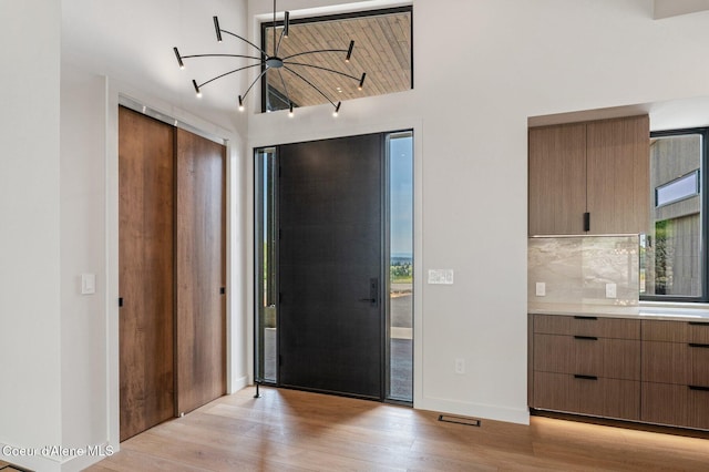 15374 S Chalone Dr, Coeur Dalene, ID 83814 - foyer entrance featuring light wood-style flooring and vaulted ceiling
