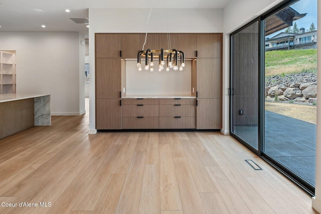 15374 S Chalone Dr, Coeur Dalene, ID 83814 - unfurnished dining area featuring a chandelier, light wood-style floors, and recessed lighting