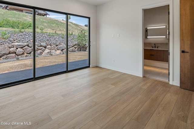 15374 S Chalone Dr, Coeur Dalene, ID 83814 - unfurnished room with light wood finished floors and a sink