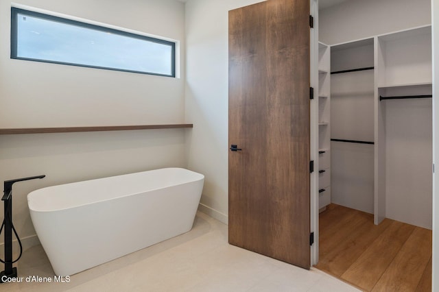 15374 S Chalone Dr, Coeur Dalene, ID 83814 - full bathroom featuring a freestanding bath and a spacious closet