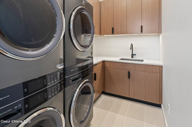 15374 S Chalone Dr, Coeur Dalene, ID 83814 - laundry room featuring cabinet space, stacked washing machine and dryer, light tile patterned flooring, and washer and dryer