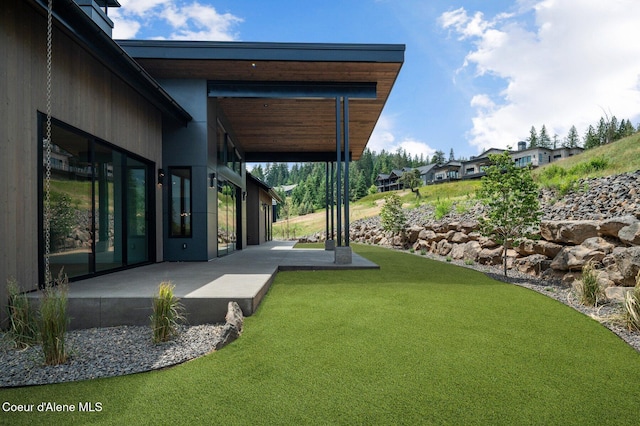 15374 S Chalone Dr, Coeur Dalene, ID 83814 - view of green lawn with a patio
