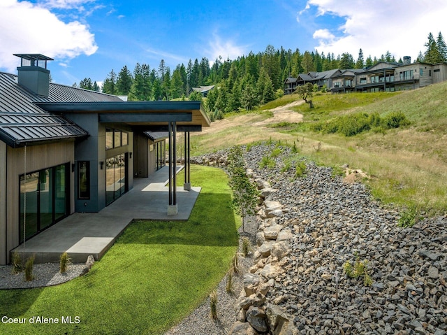15374 S Chalone Dr, Coeur Dalene, ID 83814 - view of green lawn with a patio area