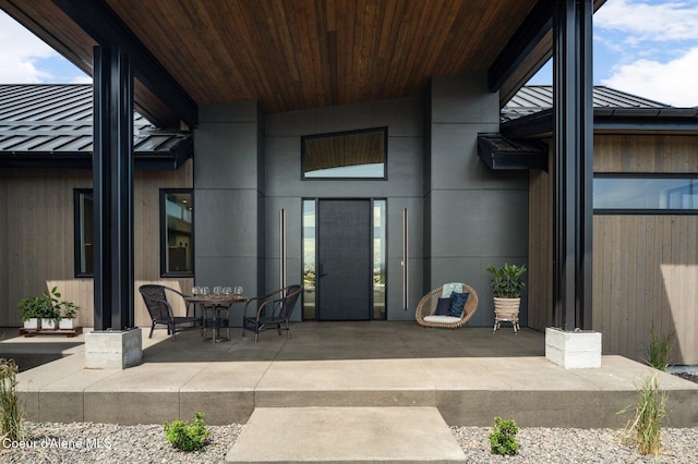 15374 S Chalone Dr, Coeur Dalene, ID 83814 - property entrance featuring a patio and a metal roof