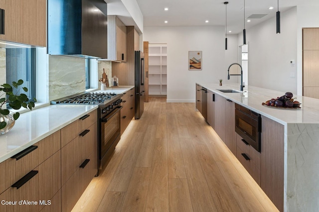 15374 S Chalone Dr, Coeur Dalene, ID 83814 - kitchen with black appliances, modern cabinets, exhaust hood, light wood-style flooring, and recessed lighting
