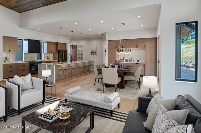 15374 S Chalone Dr, Coeur Dalene, ID 83814 - living area with light wood-style floors, a chandelier, and recessed lighting