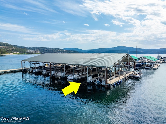 view of dock featuring a water and mountain view