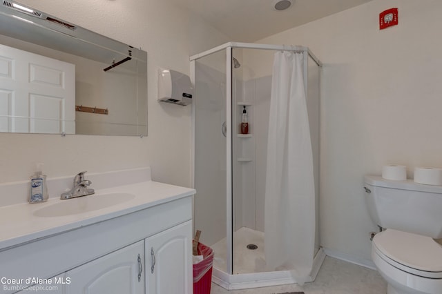 bathroom featuring vanity, tile patterned floors, toilet, and a shower with shower curtain