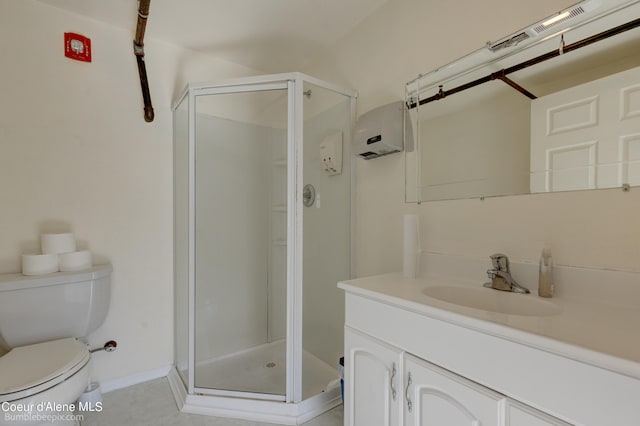 bathroom featuring vanity, toilet, and a shower with door