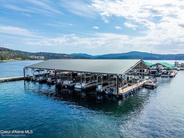 dock area featuring a water and mountain view