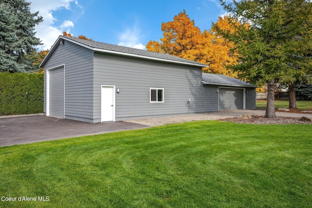 exterior space featuring a yard and a garage