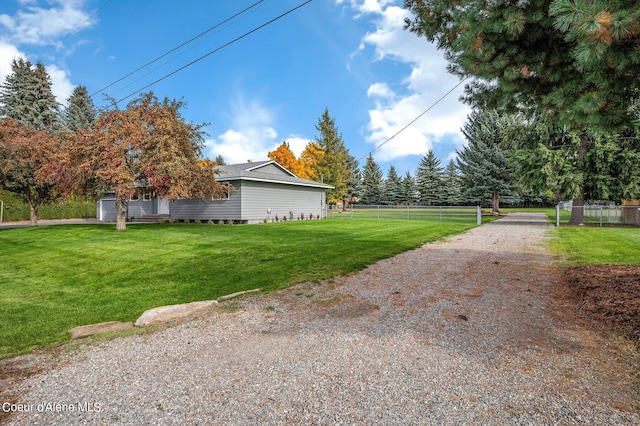 view of side of property featuring a yard