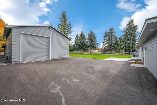 garage featuring a yard