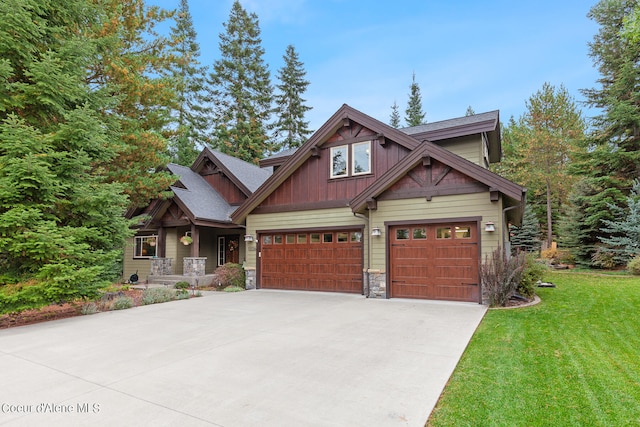 craftsman-style home featuring a front lawn and a garage