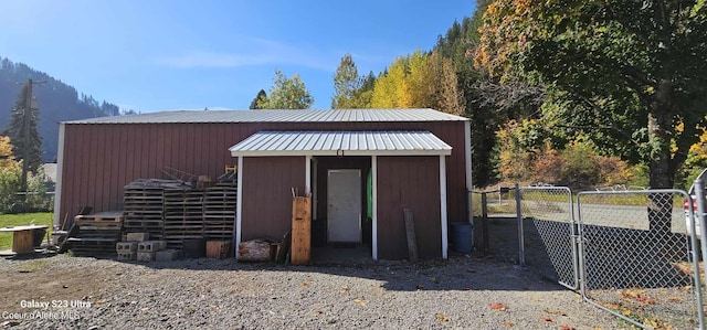 view of outbuilding with a mountain view