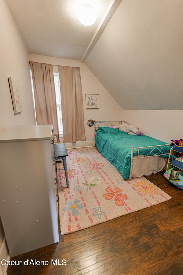 bedroom with dark hardwood / wood-style floors and vaulted ceiling