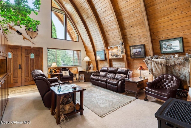 living room with beam ceiling, wooden walls, high vaulted ceiling, and wooden ceiling