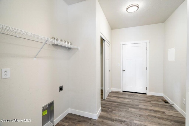 laundry room featuring hardwood / wood-style floors and electric dryer hookup