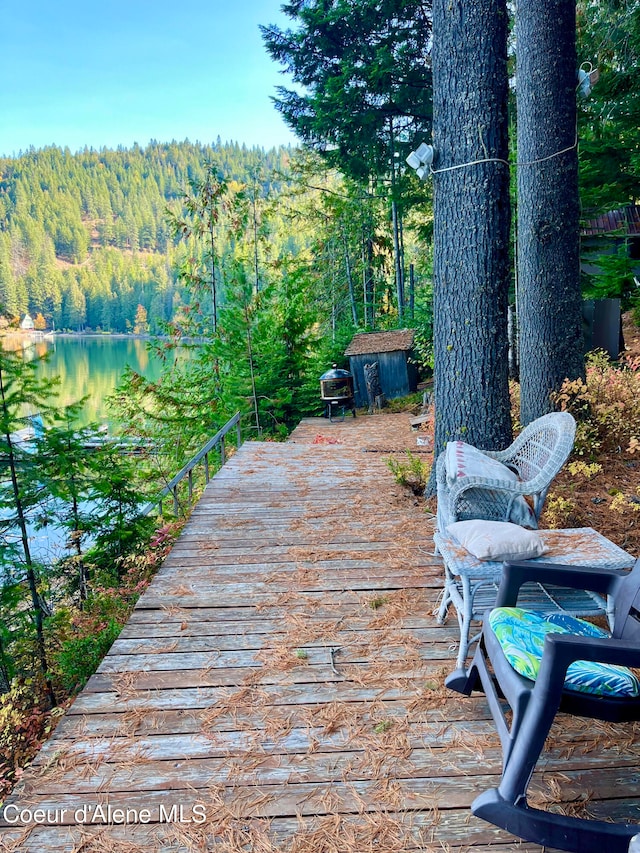 wooden terrace with a water view