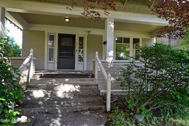 property entrance with covered porch