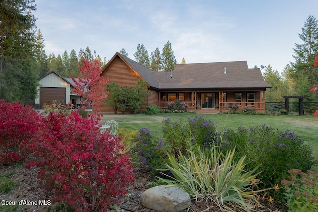 view of front of house with a front yard and a porch