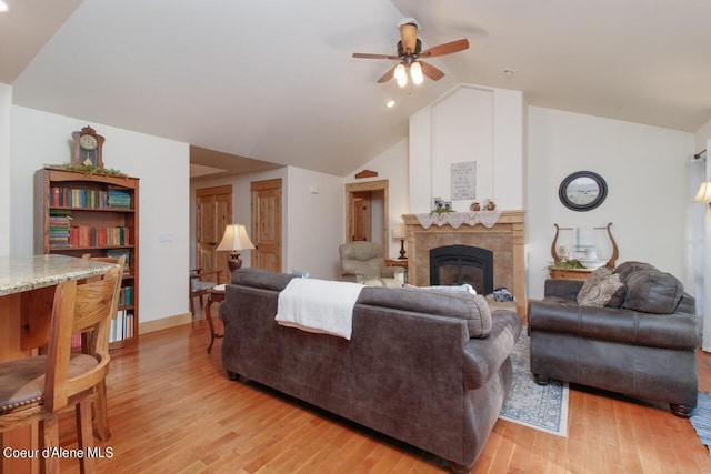 110 Sheri Dr, Moyie Springs, ID 83845 - living room with ceiling fan, light wood-style floors, a tile fireplace, lofted ceiling, and recessed lighting