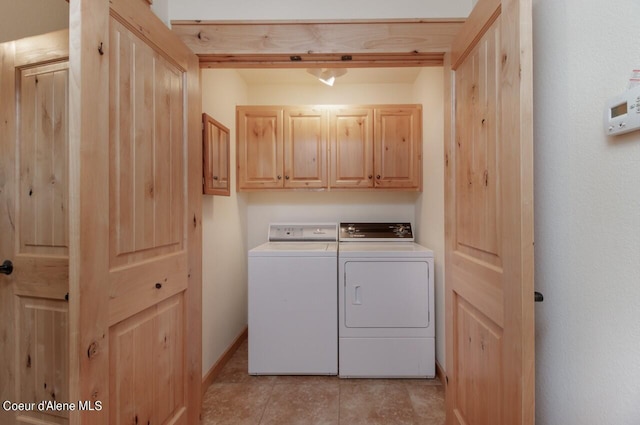 110 Sheri Dr, Moyie Springs, ID 83845 - laundry room with cabinet space, washer and dryer, and light tile patterned flooring