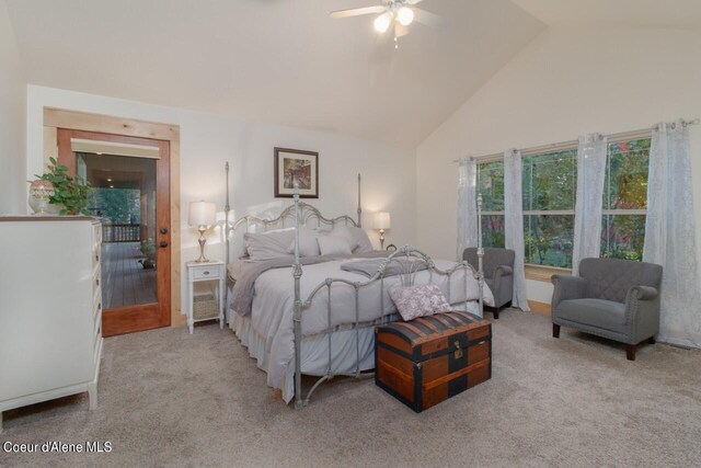 carpeted bedroom with high vaulted ceiling and ceiling fan