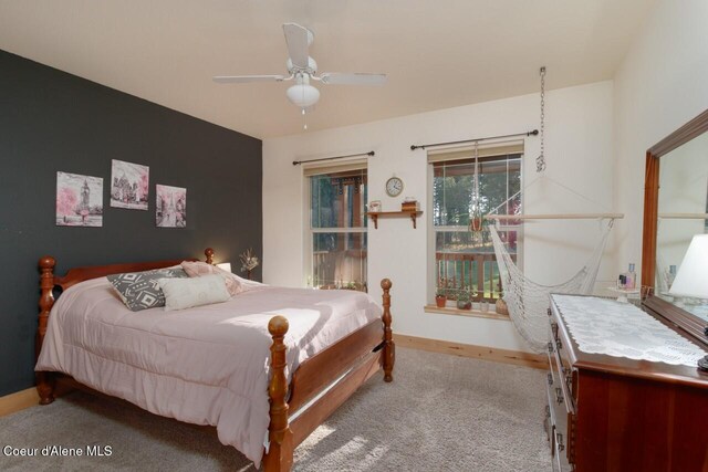 bedroom with ceiling fan and light colored carpet