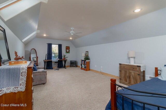 carpeted bedroom featuring vaulted ceiling and ceiling fan