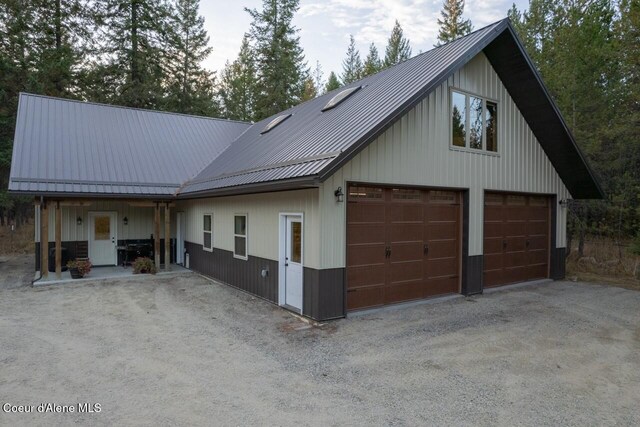 modern inspired farmhouse featuring a garage