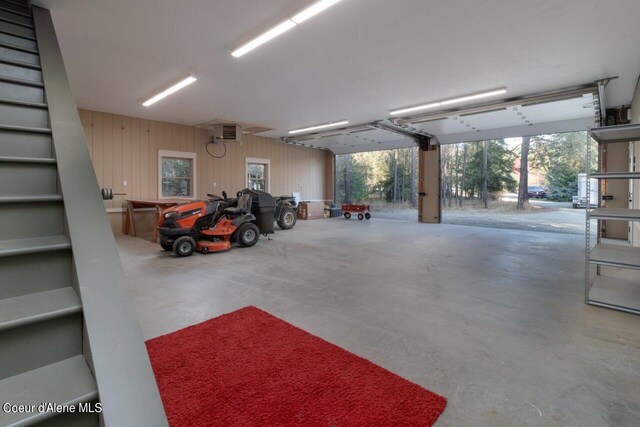 garage featuring wooden walls