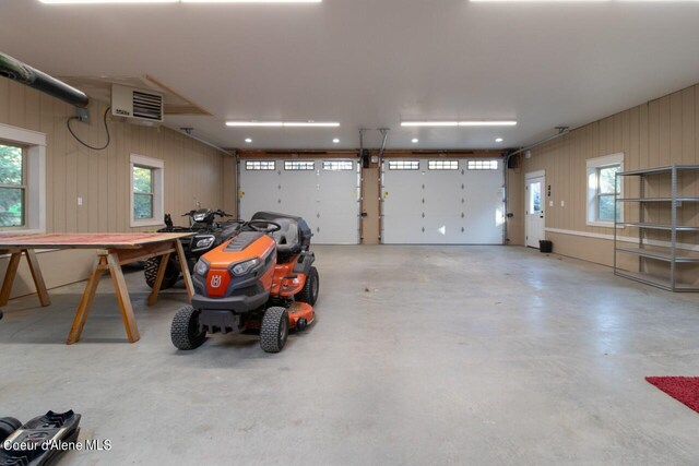 garage featuring wooden walls