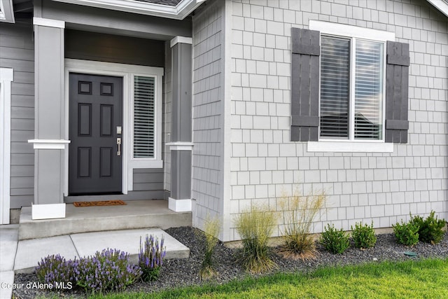 doorway to property with a porch