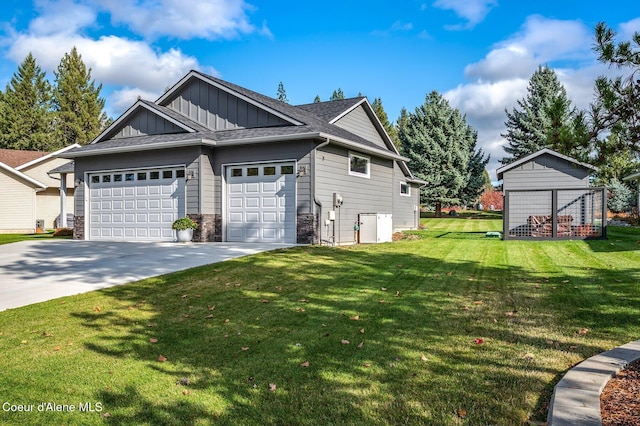 view of home's exterior with a lawn and a garage