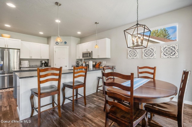 dining space featuring dark hardwood / wood-style flooring