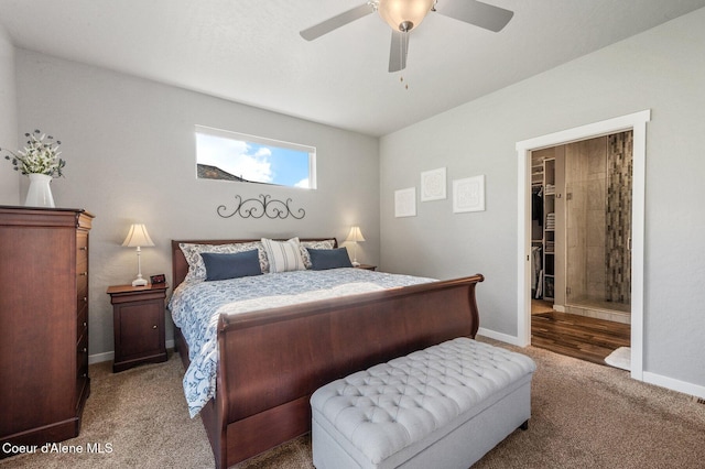 carpeted bedroom featuring a closet, a spacious closet, and ceiling fan