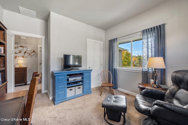 living room with light colored carpet