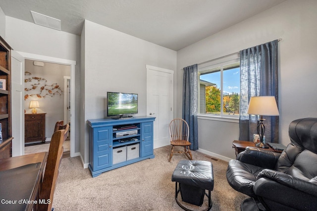 sitting room with light colored carpet