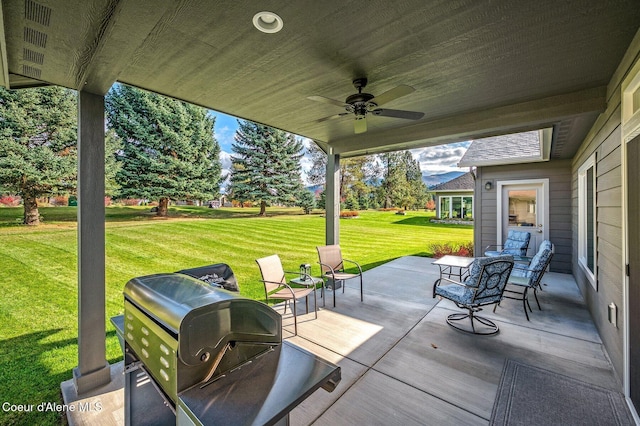 view of patio / terrace featuring grilling area and ceiling fan