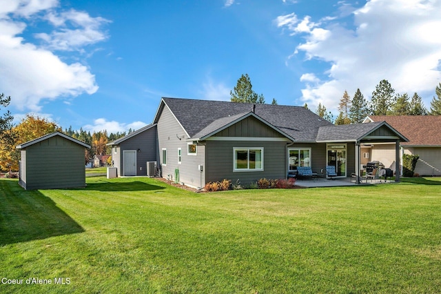 back of house featuring a yard, a patio, and central AC unit