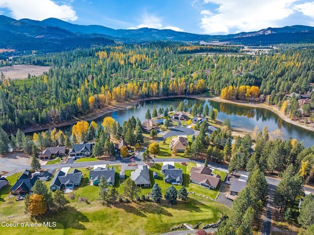 bird's eye view with a water and mountain view