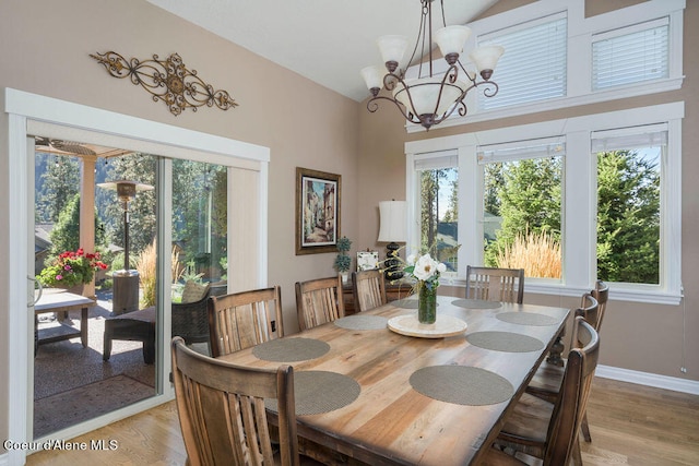 dining space featuring a chandelier and light hardwood / wood-style floors