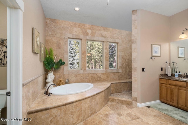 bathroom with tile walls, vanity, tile patterned floors, and separate shower and tub