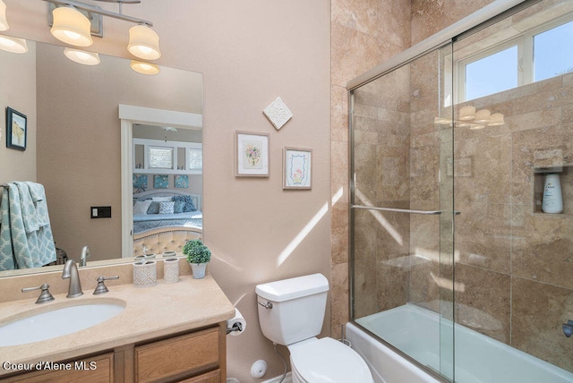 full bathroom featuring bath / shower combo with glass door, vanity, toilet, and a chandelier