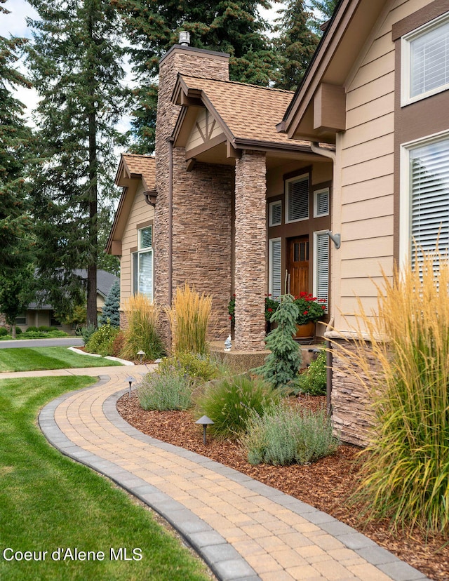 view of side of home featuring a lawn