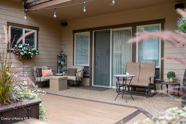 wooden deck featuring an outdoor hangout area