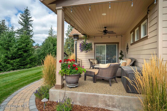 view of patio featuring ceiling fan