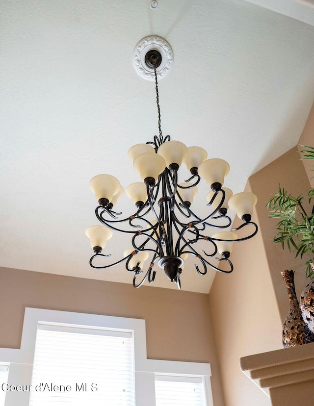 interior details featuring a chandelier