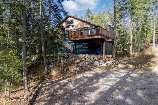 back of property with a wooden deck